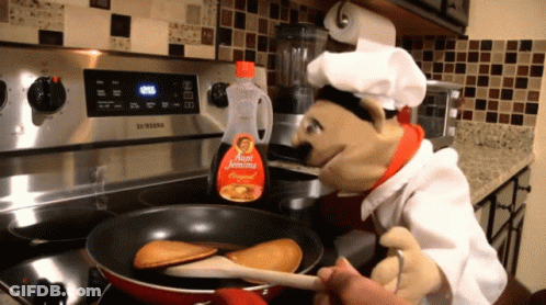 A Bottle Of Aunt Jemima Syrup Sits On The Stove GIF