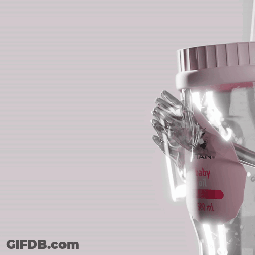 A Bottle Of Baby Oil Is Being Poured Into A Cup GIF