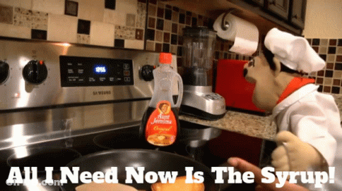 A Bottle Of Burt Jemima Syrup Sits On A Stove Top GIF