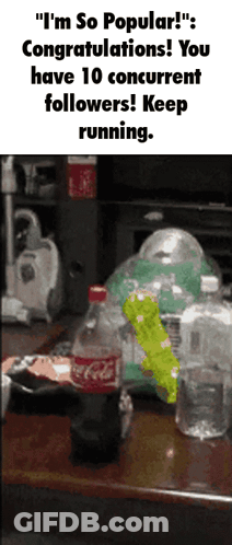 A Bottle Of Coca Cola Sits On A Table Next To A Pile Of Other Bottles GIF