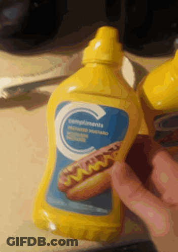 A Bottle Of Compliments Mustard Has A Picture Of A Hot Dog On It GIF