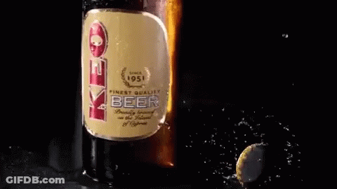 A Bottle Of Eve Beer Is Being Poured Into A Cup GIF