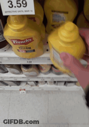 A Bottle Of French 'S Yellow Mustard Sits On A Shelf GIF
