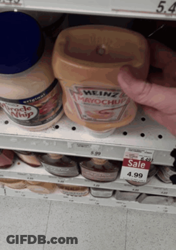 A Bottle Of Heinz Mayonnaise Sits On A Shelf In A Store GIF