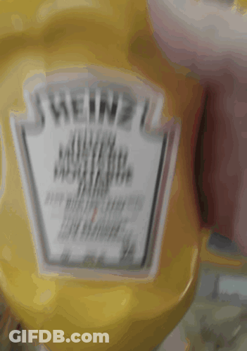 A Bottle Of Heinz Mustard Sits On A Counter GIF