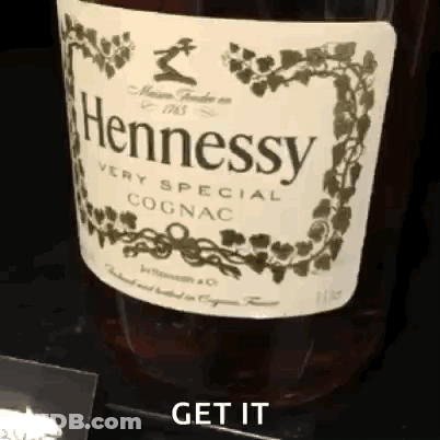 A Bottle Of Hennessy Very Special Cognac Is On A Table GIF
