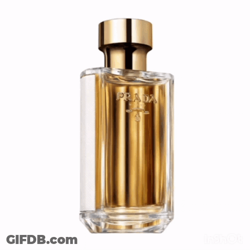 A Bottle Of La Femme Prada Perfume Sits Next To Its Box GIF