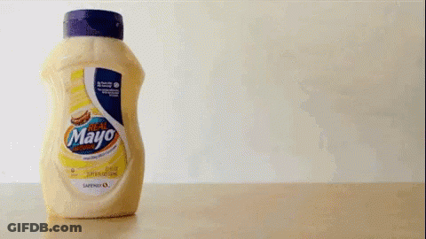 A Bottle Of Mayonnaise Is Being Poured Into Another Bottle GIF