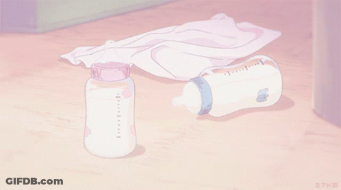 A Bottle Of Milk Sits On A Wooden Floor Next To A Towel GIF