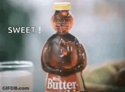 A Bottle Of Mrs. Butter Is Sitting On A Table Next To A Jar GIF