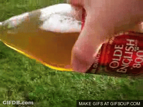 A Bottle Of Olde English Cider Being Poured Into A Glass GIF