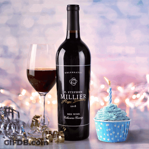 A Bottle Of P. Stephen Millier Red Wine Next To A Cupcake With Blue Frosting GIF
