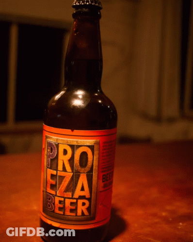 A Bottle Of Pro Ezza Beer Sits On A Table GIF