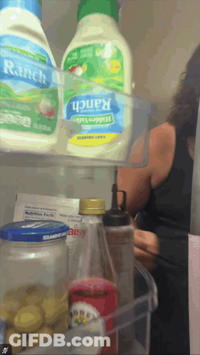 A Bottle Of Ranch Salad Dressing Sits On A Shelf In A Refrigerator GIF