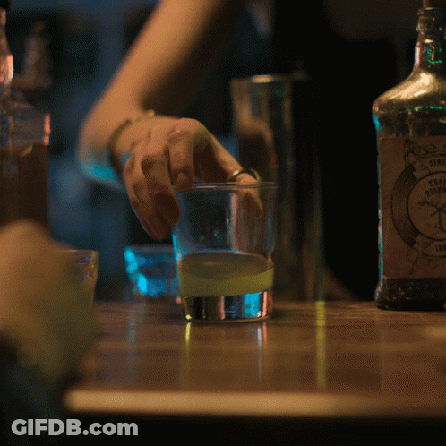 A Bottle Of Sierra Nevada Tequila Sits On A Wooden Table GIF