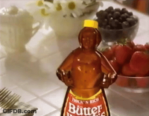 A Bottle Of Thick N Rich Butter Sits On A Table Next To Fruit GIF
