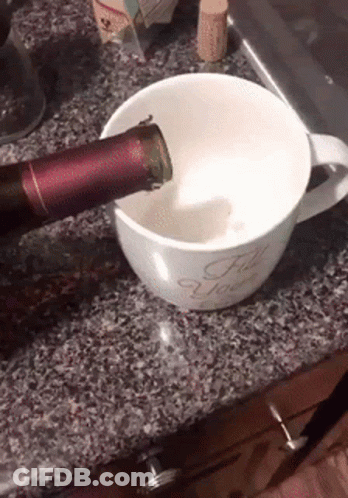A Bottle Of Wine Is Being Poured Into A Coffee Mug That Says For You GIF