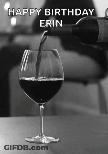 A Bottle Of Wine Is Being Poured Into A Glass With The Name Erin Written On The Bottom GIF