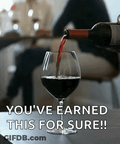 A Bottle Of Wine Is Being Poured Into A Glass With The Words " You 'Ve Earned This For Sure " Below It GIF