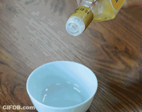 A Bottle With The Number 12 On It GIF