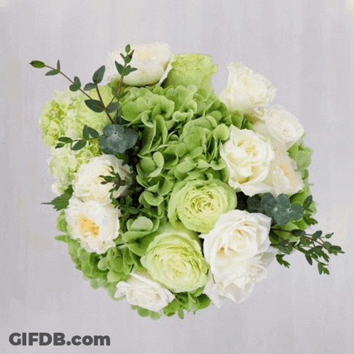 A Bouquet Of Colorful Flowers Including Roses And Chrysanthemums GIF