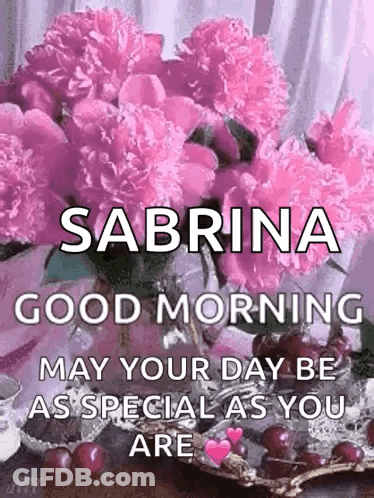 A Bouquet Of Pink Flowers In A Vase With The Name Sabrina On It . GIF