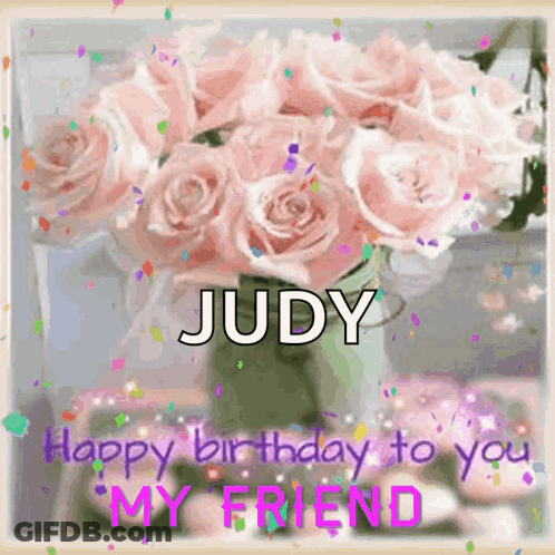 A Bouquet Of Pink Roses In A Vase With The Name Judy Written On It GIF