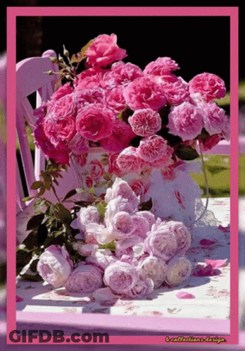 A Bouquet Of Pink Roses Sits On A Table With A Purple Chair In The Background GIF