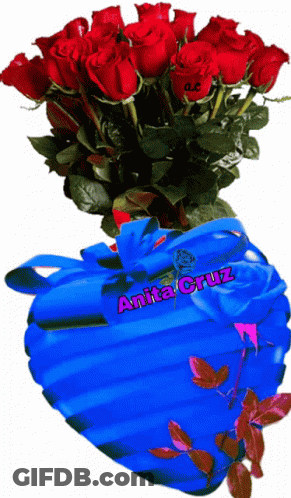 A Bouquet Of Red Roses In A Blue Heart Shaped Vase With Anita Cruz Written On The Bottom GIF