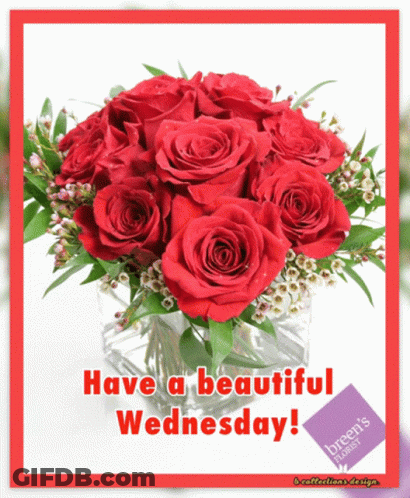 A Bouquet Of Red Roses In A Glass Vase With The Words Have A Beautiful Wednesday GIF