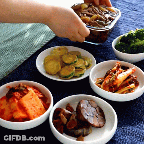 A Bowl Of Broccoli Sits On A Table Next To A Bowl Of Vegetables GIF