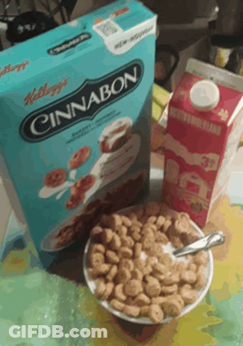 A Bowl Of Cereal Next To A Box Of Kellogg 'S Cinnamon Cereal GIF