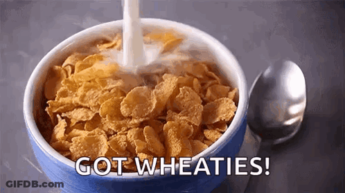 A Bowl Of Cereal With Milk Being Poured Into It And The Words `` Got Wheaties '' Written On The Bottom . GIF