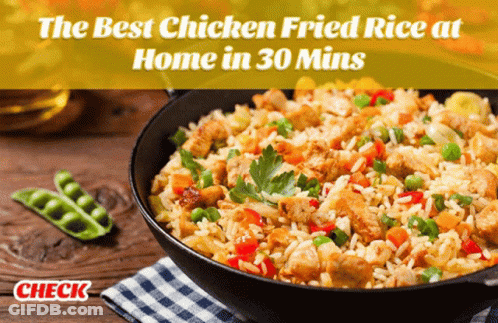 A Bowl Of Chicken Fried Rice Sits On A Checkered Cloth GIF