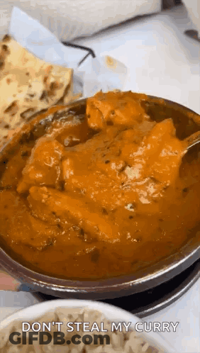 A Bowl Of Curry With A Spoon In It And The Words `` Do N't Steal My Curry '' On The Bottom . GIF