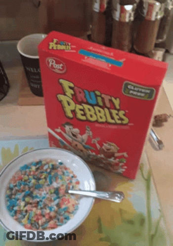 A Bowl Of Fruity Pebbles Cereal Next To A Box Of Cereal GIF
