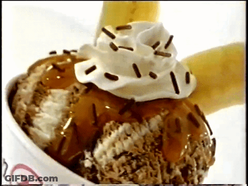 A Bowl Of Ice Cream With Whipped Cream And Chocolate Sprinkles GIF