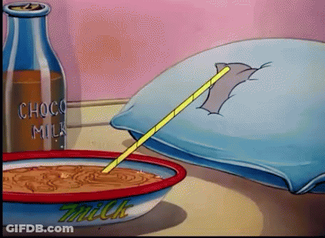 A Bowl Of Milk Sits On A Table Next To A Bottle Of Choco Milk GIF