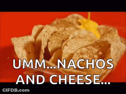 A Bowl Of Nachos With Cheese Being Poured Over Them GIF