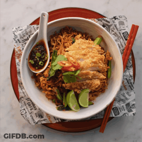 A Bowl Of Noodles With A Spoon And Chopsticks Sits On A Napkin That Says Cafe On It GIF