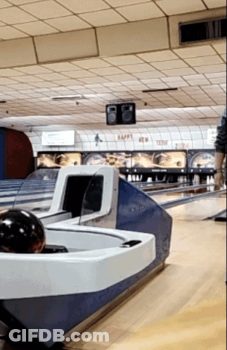 A Bowling Alley That Says Happy New Year On The Ceiling GIF