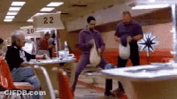 A Bowling Alley With A Sign That Says Number 22 GIF