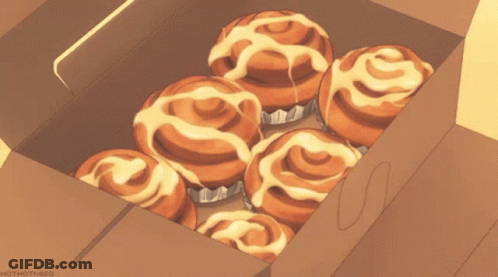 A Box Of Cinnamon Rolls Is Being Opened GIF