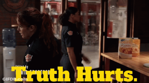 A Box Of Corn Flakes Sits On A Table Next To Two Women In Uniform GIF