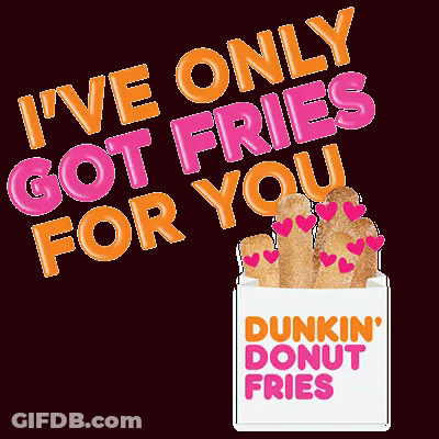 A Box Of Dunkin ' Donut Fries With Hearts On Them On A Black Background GIF