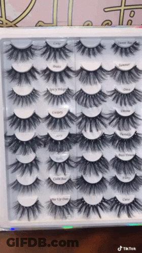 A Box Of Fake Eyelashes With Labels On Them Including One That Says ' Cutie ' GIF