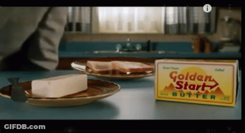 A Box Of Golden Start Butter Sits Next To A Plate Of Food GIF