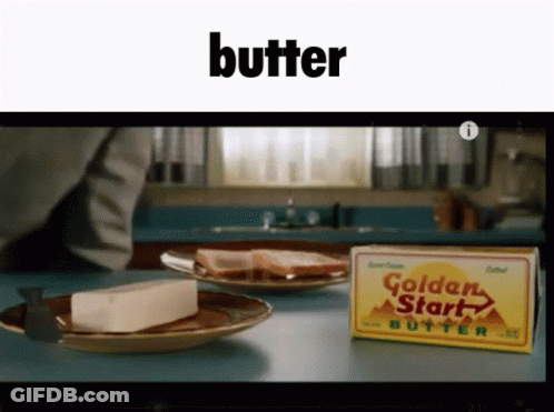 A Box Of Golden Start Butter Sits Next To A Slice Of Bread On A Plate GIF