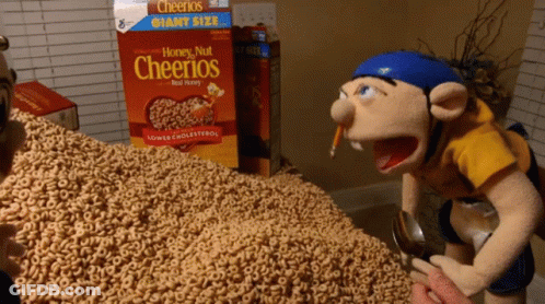A Box Of Honey Nut Cheerios Sits On A Table GIF
