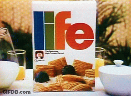 A Box Of Life Cereal Sits On A Table Next To Bowls Of Cereal GIF